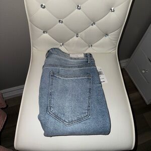 Asymmetrical waist jeans